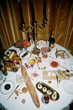 the table is set with many different types of food