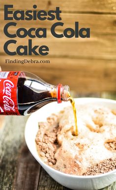 a person pouring coke into a bowl of ice cream