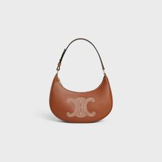 AVA BAG IN SMOOTH CALFSKIN WITH TRIOMPHE EMBROIDERY - TAN | CELINE Celine Ava, Luxury Stuff, Fragrance Bottle, Direct Lighting, Pretty Bags, Aging Beautifully, Fragrance Collection, New Fragrances, Hand Cream