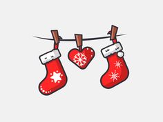 two christmas stockings hanging from a clothes line with snowflakes and hearts on them