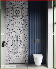 a bathroom with a toilet, shower and wallpaper in the same color as the walls