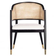 a black and white chair with wicker back, gold trimmings and arms