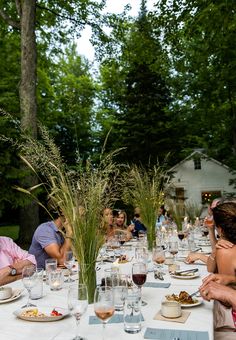 a group of people sitting around a dinner table