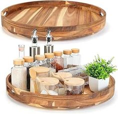 two wooden trays with spices and herbs on them