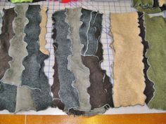 several pieces of fabric laid out on a table