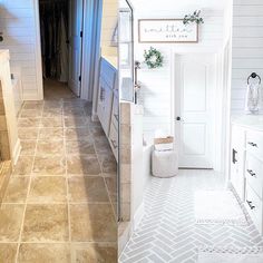 before and after photos of a bathroom remodel with white cabinets, tile flooring and walls