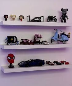 three white shelves filled with toys and figurines