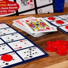 playing cards and dice on a wooden table