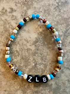 "Zach Bryan bracelet available in any song title, lyric or phrase. Customized just for you!  $4 for 1. This bracelet is strung on a stretchy cord and offered in 3 sizes: 5.75\" (child or women), 6.75\" (most popular women's size), 8.5\" (typically best for men). See pictures for options but we are willing to customize if there is a song or phrase you don't see shown. Please specify the album, song or lyrics in your message. Note: supplies of gold and colored beads are limited. Most bracelets are made with black letters unless otherwise requested. Disclaimer: No refunds. Seller not responsible for damage due to overstretching. All bracelets are unique; colors of beads and letters may vary slightly from photos." Zach Bryan Bracelet Ideas, Make Clay Beads, Couple Bracelets, Black Letter, Braided Bracelets, Dream Jewelry, Clay Beads, Friendship Bracelets, No Response