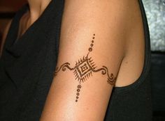 a woman with a tattoo on her arm