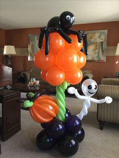 an inflatable balloon with a spider on top and balloons attached to the bottom