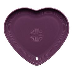 a purple heart shaped dish on a white background with the shape of a heart in the center