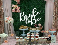 a table with cupcakes, cakes and desserts on it that says bride to be