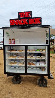 the snack box has many donuts in it and is ready to be bought for sale