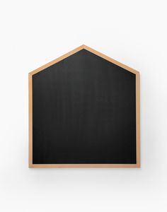 a blackboard mounted on the wall with a wooden frame in front of white background