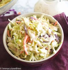 a white bowl filled with coleslaw and dressing