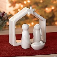 a white nativity scene with a star on top