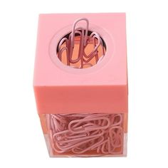 a pink box with some paper clips in it