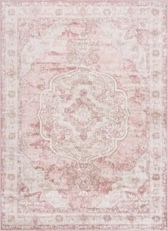 an antique style rug with pink and beige colors