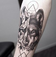 a black and white photo of a wolf with geometric shapes on it's arm