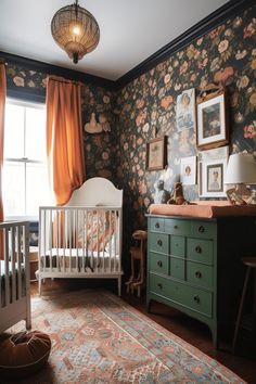 a baby's room with floral wallpaper and green dresser in the foreground