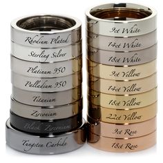 the wedding rings are stacked on top of each other, and they have names in them