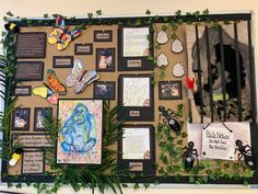 a bulletin board covered in lots of pictures and magnets with plants growing on it