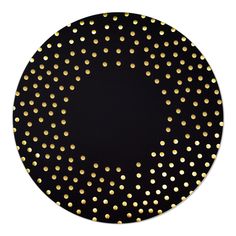 a black plate with gold dots on it