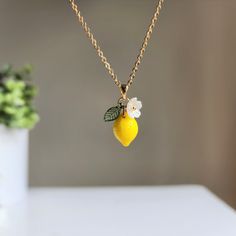 Citrus lovers? Can't find your perfect length necklace? Have material requirements? We are here to help you design your own lemon fruit necklace. You design the necklace. We handmade it with high quality Czech glass lemons, acrylic flowers, acrylic leaves, and 14K gold-plated or 925s silver plated chains. We offer different length options,16inch, 18inch, 20inch, 24inch, and 36inch. We have the transparent lemons and opaque lemons. Lemon Jewelry, Lemon Necklace, Acrylic Leaves, Holiday Fruit, Food Necklace, Flowers Acrylic, Rain Design, Fruit Necklace, Lemon Fruit