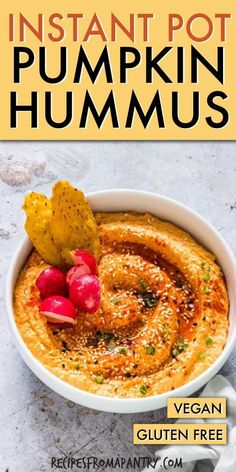 the cover of instant pot pumpkin hummus is shown in a bowl with chips on top