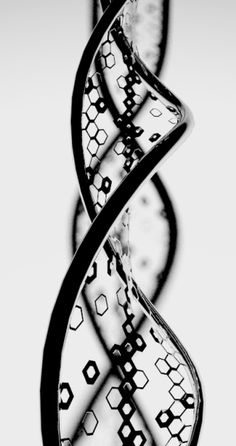 an abstract black and white photo of a double - stranded spiral shaped object with hexagonal shapes