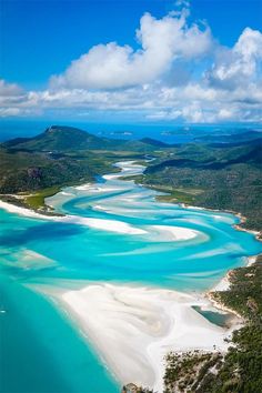 an aerial view of white sand beach and lagoons in the whit islands, new zealand