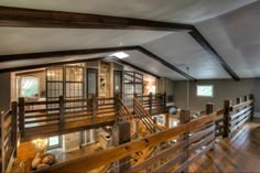 a large open floor plan with wooden railings