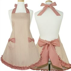 two aprons with pink bows on them