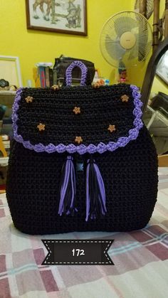 a crocheted purse sitting on top of a table