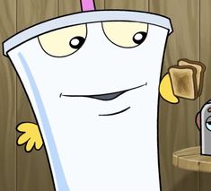 a cartoon character is holding a toaster and looking at the camera while standing in front of a wood paneled wall