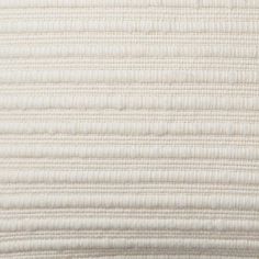 the textured fabric is white and has vertical stripes on it, as well as horizontal lines