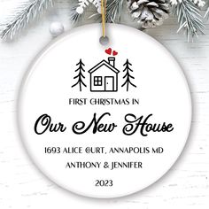 a christmas ornament with the words our new house on it