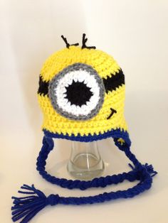 a crocheted hat with an eyeball on it