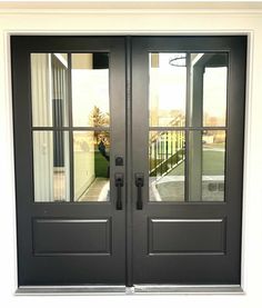 two black double doors with glass panels on the front and side of each door,