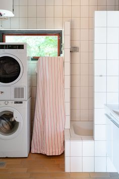 a washer and dryer in a small room