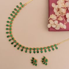 Description: Crafted with a sequence of semi-precious kempu stones, this classic antique gold-plated necklace is a versatile choice, whether for a summer wedding ensemble or a casual get-together. Its demure elegance is a testament to the fusion of exquisite jewelry design and artistic mastery, ensuring it stands out as a head-turner in any setting. Details & Specification: Materials used: Brass Alloy with Antique Gold Plating Weight - Necklace- 28.55 gm, Earrings- 5.8 gm Length - Necklace-11cm, Gold Kundan Necklace With Stones In Temple Jewelry Style, Elegant Gold Temple Necklace With Stone Setting, Festive Gold Temple Necklace With Stones, Traditional Green Turquoise Necklace With Natural Stones, Festive Green Gemstone Temple Necklace, Green Polished Beads Temple Necklace, Green Multi-stone Necklaces With Round Beads, Green Gemstone Bollywood Necklace, Choker Pendant