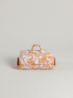 an orange and white box with handles