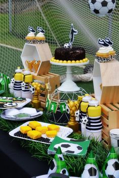 a soccer themed party with cupcakes and cake