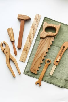 wooden tools are laid out on a cloth