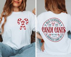 Front And Back Candy Canes Shirt - Gift For Christmas - Christmas Shirt - Christmas Party Shirt - Christmas Candy Shirt - Xmas Family Shirt How can I order? 1️) Please review all the information provided before placing an order 2️) Select the shirt type and size. 3️) Select the color of the shirt using the following options. 4️) Please add the vinyl color (white or black) in the optional message section of the order. 5️) Need more Items? Add the current item in the cart. And If you like to add m Candy Cane Vinyl Shirt, Christmas Shirt Cricut, Casual Pre-shrunk Christmas Shirt, Pre-shrunk White Christmas Shirt, Candy Cane Shirt Ideas, Cute Christmas Shirts Vinyl, Candy Cane Outfit, Candy Cane Shirt, Christmas Shirts Vinyl