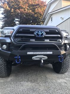 the front end of a black toyota truck