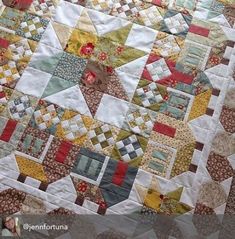 a close up of a quilt on a table