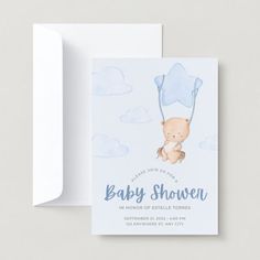 a baby shower card with a teddy bear holding a blue balloon on it's back