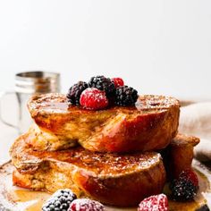 french toast topped with berries and powdered sugar